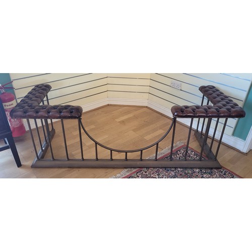 A fine 20th century brass club fender, having buttoned brown leather corner seats above scrolling spindle shaped supports, raised on an ogee moulded base, W185, H60, D66cm.
