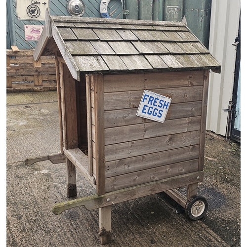 A quality built Chicken shed with barrow arms and wheels, wood shingle roof
