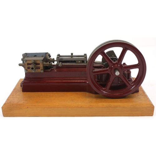 A Stuart Turner compressed air beam engine, mounted on a wood base, 25  x 12cm