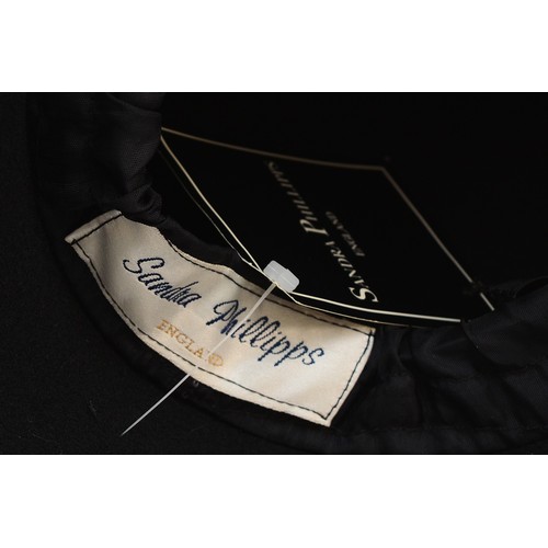 22 - Philip Treacy Black brimmed hat with fur trim, together with a Sandra Phillips black felt cloche wit... 