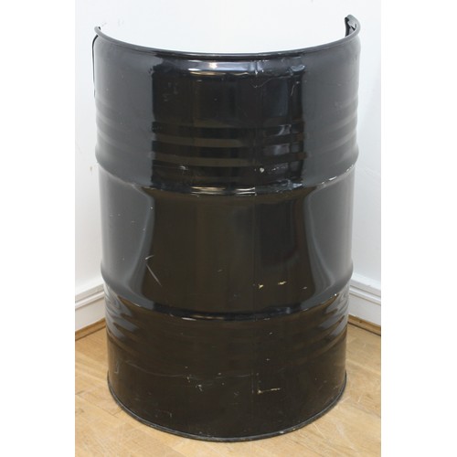 43 - A large painted black oil drum, converted into a seat, with cushion, 87cm tall.