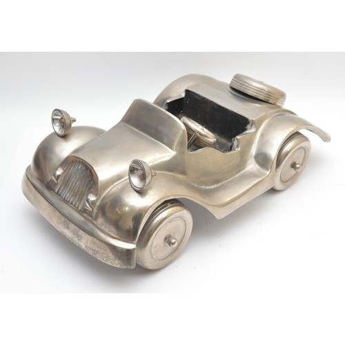 54 - An alloy open top sports car, 60 x 35cm.