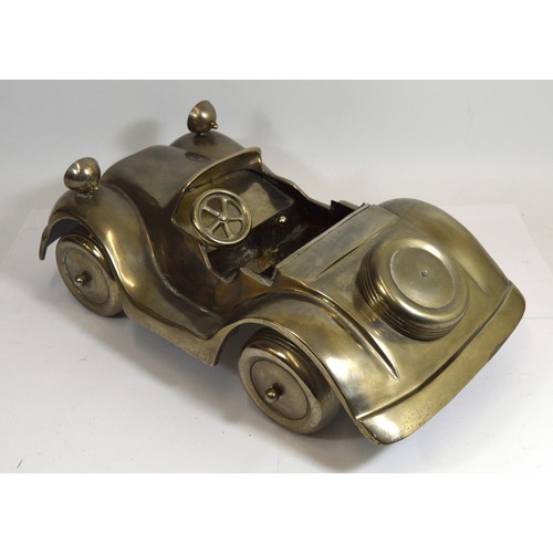54 - An alloy open top sports car, 60 x 35cm.