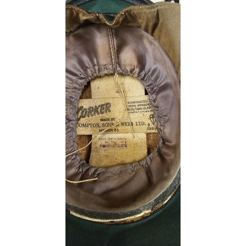 51 - A Compton & Son black cork helmet, together with a top box