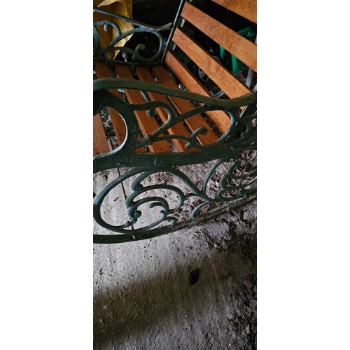 15 - A Victorian style cast iron painted garden rocking chair, early 20th century, with pivoting back sup... 