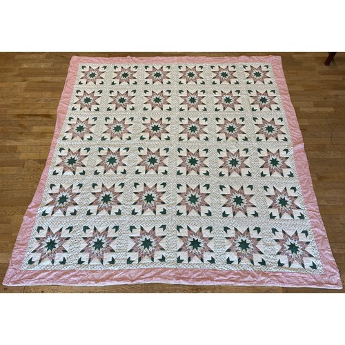 23 - A large patchwork quilt, in a Chintz style decoration, stitched in pink and green, 244cm x 244, toge... 