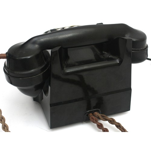 29 - A mid-twentieth century black Bakelite rotary telephone, h. 15cm x w. 18.5cm.