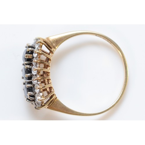 34 - A 9ct gold sapphire and gemset cluster ring, London 1984, M, 2.2g