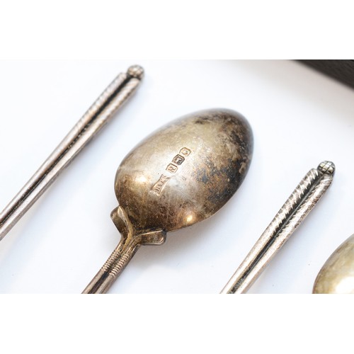37 - A set of six silver teaspoons, Sheffield 1958, with handles in the form of two golf clubs, by Walker... 