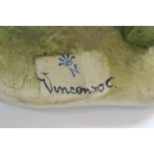 41 - Capodimonte; two figural porcelain sculptures, one depicting an unhoused individual on a park bench ... 