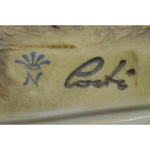 42 - Capodimonte; three figural porcelain sculptures, depicting a young boy washing his hands, h. 14cm, a... 