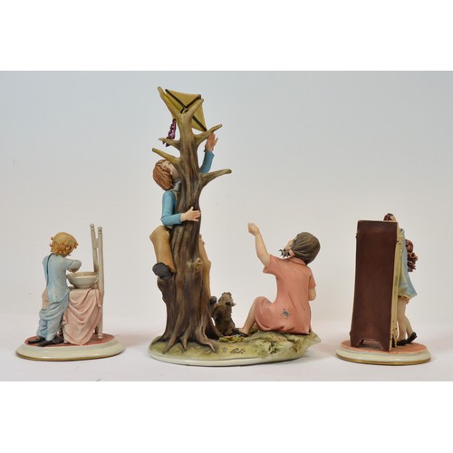 42 - Capodimonte; three figural porcelain sculptures, depicting a young boy washing his hands, h. 14cm, a... 
