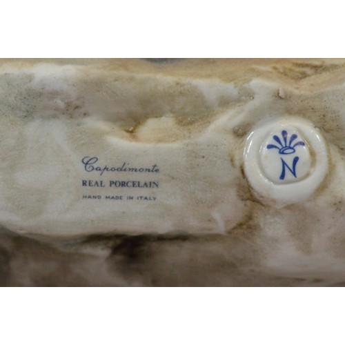 43 - Capodimonte; a large figural group, depicting a Romani woman with an infant on her lap and an adoles... 