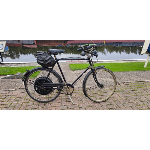 c.1951 gentleman's Raleigh Cyclemaster 32cc. Registration number BHF 76 (not listed with DVLA). Frame number 107170 T. Engine number 132229.
There is no paperwork with this machine, please note the frame number of the ladies Raleigh. This number plate was issued in Wallasey in 1951.
The Cyclemaster motorised wheel started life with a group of German engineers, post WWII, who worked for HNG in the Hague, as an engine that went above the front wheel. This was too expensive to produce but it was developed into a motorised rear wheel and went into production in November 1949. Due to the German engineers being considered prisoners of war the blue prints were confiscated by the Interpro Buro, a joint English, American and French organisation set up to help the post war Dutch industry and sent to the UK for copying.
The English version was manufactured at the EMI factories in Hayes, Middlesex and marketed by a new company called Cyclemaster Ltd from June 1950, with initially a 25.7 cc (black) engine and then a 32 cc (silver) one from November 1951. In the late 1950's with increases in purchase tax and competition from the new mopeds on the market, sales dwindled and finally ceased in 1961.