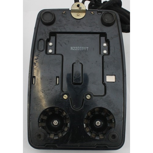 A signal box wooden cased wall telephone and a black Bakelite internal ...