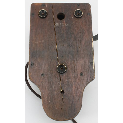A signal box wooden cased wall telephone and a black Bakelite internal ...