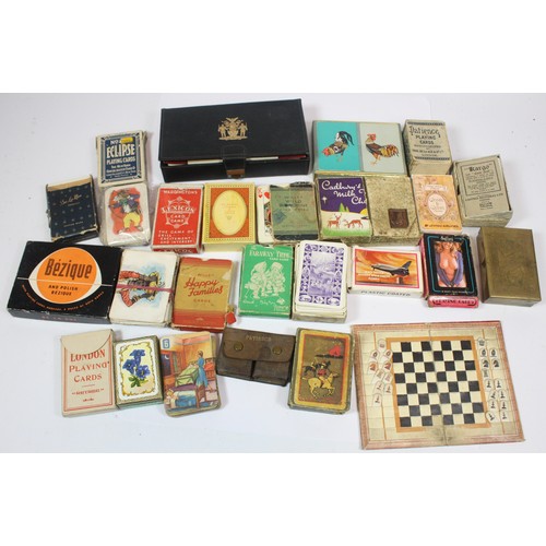 A collection of assorted vintage packs of playing cards and card ...