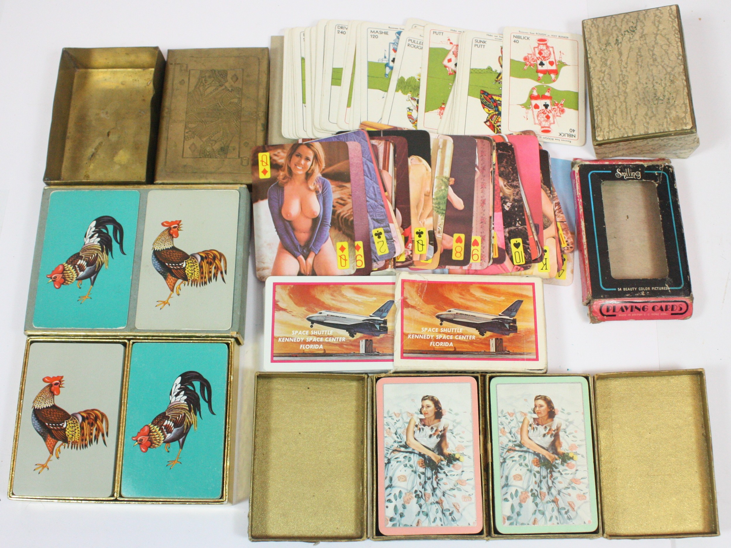 A collection of assorted vintage packs of playing cards and card ...