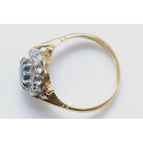 3 - An 18ct gold sapphire and diamond cluster ring, K, 4.5g