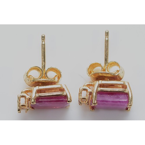 8 - A pair of 14K gold ruby and diamond earrings with scroll backs, 1.8g