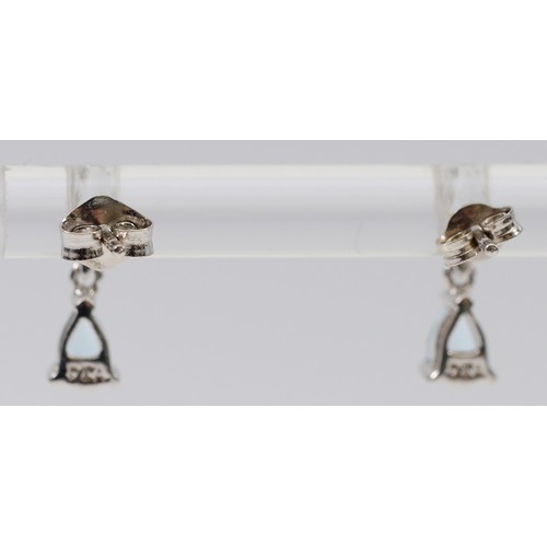 14 - A pair of 9ct white gold aquamarine drop earrings with scroll backs, 0.9g