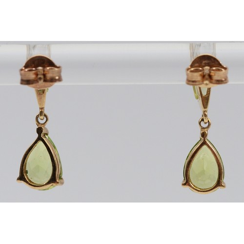 21 - A pair of 9ct gold peridot drop earrings with scroll backs, 1.4g