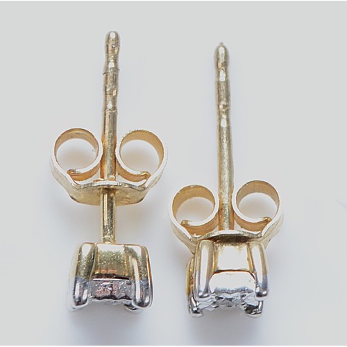 24 - A pair of 9ct gold diamond earrings with scroll backs, 0.6g