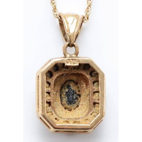 28 - A 9ct gold diamond and sapphire pendant on a chain, 13mm, 2.9g