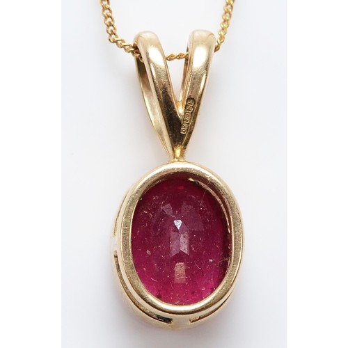 32 - A 9ct gold ruby pendant on a chain, 8mm x 6mm ruby, 2g