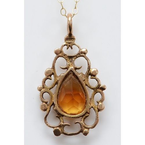 33 - A 9ct gold citrine pendant on a chain, 25mm, 1.8g