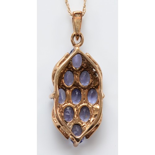 34 - A 9ct gold tanzanite and diamond pendant on a chain, 20mm, 2.2g