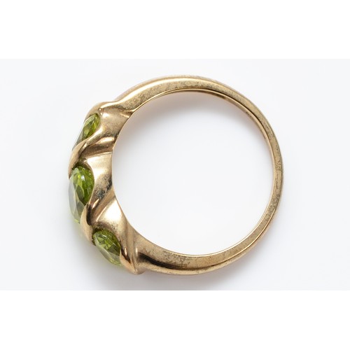 42 - A QVC 9ct gold peridot three stone ring, M, 2.8g