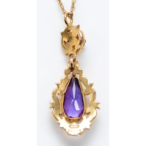 59 - A 9ct gold amethyst drop pendant on a chain, 15mm x 8mm amethyst, 5.1g