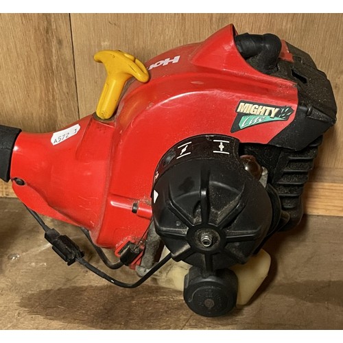 9 - Homelite 'Mighty Lite' pertol engine strimmer, a petrol engine hedge trimmer 22.5 cc engine serial n... 