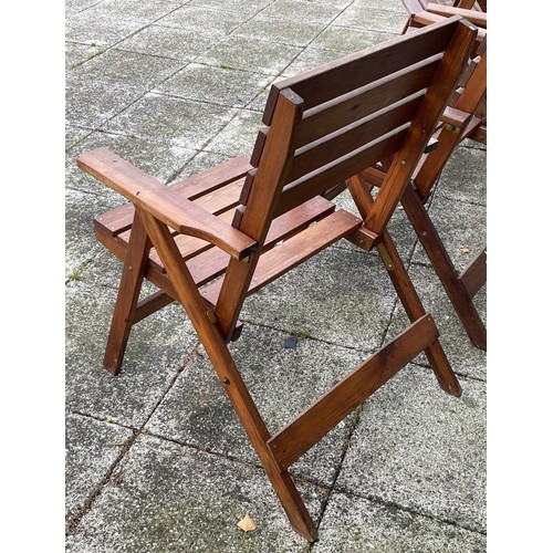 16 - A set of four hardwood folding garden armchairs, W65, H88cm.