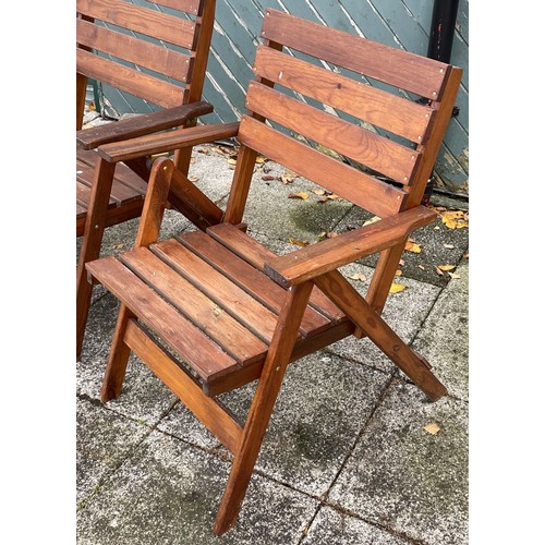 16 - A set of four hardwood folding garden armchairs, W65, H88cm.