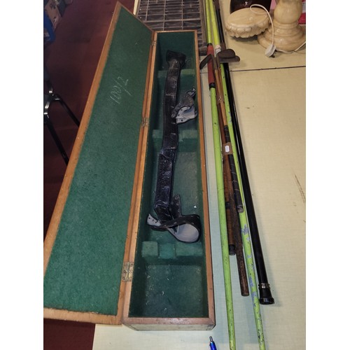 19 - Sporting related items, to include vintage golf clubs, javelin throws, and a pine sword box/case, 10... 