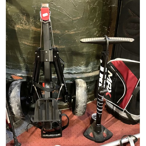 23 - A set of Dunlop Max golf clubs with a trolley, together with a bundle of trekking poles, umbrellas, ... 