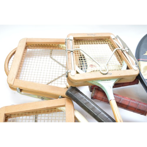 24 - Eight vintage tennis and squash rackets, seven of them being in presses. (8)