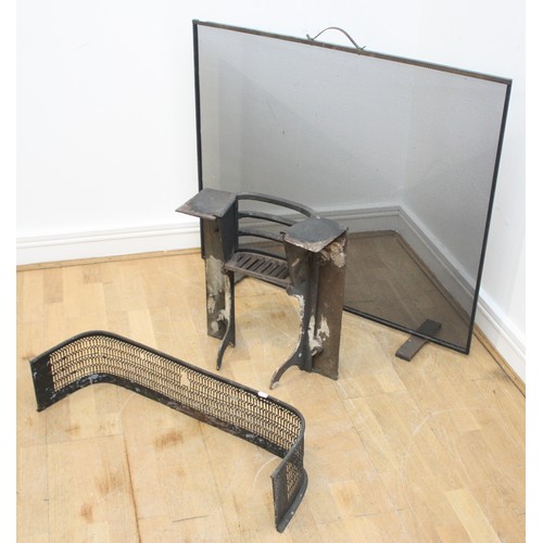 25 - An Arts & Crafts cast iron fire grate, W44, H50, D19cm, together with a steel and wire mesh firescre... 