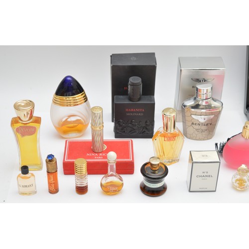 39 - Nineteen perfume bottles, miniature and full-size, to include, Chanel No. 5, Bentley Infinite Rush, ... 