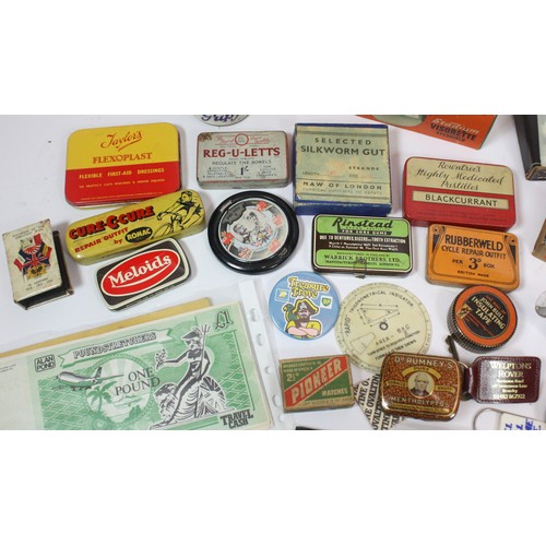 49 - A selection of 20th century collectables, to include early advertising tins, badges, bottle openers,... 
