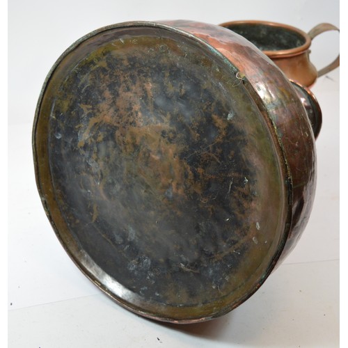 52 - An antique copper pitcher, h. 41cm, and a dovetailed copper jug, h. 23cm. (2)