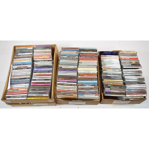 A collection of over one hundred music CD's, in three boxes.