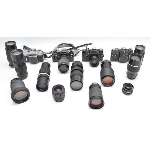 An assortment of camera lenses with two Zenit film cameras, examples to ...
