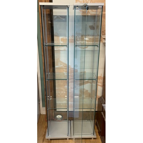 372 - A pair of modern freestanding slimline glazed display cabinets, illuminated with three adjustable gl... 