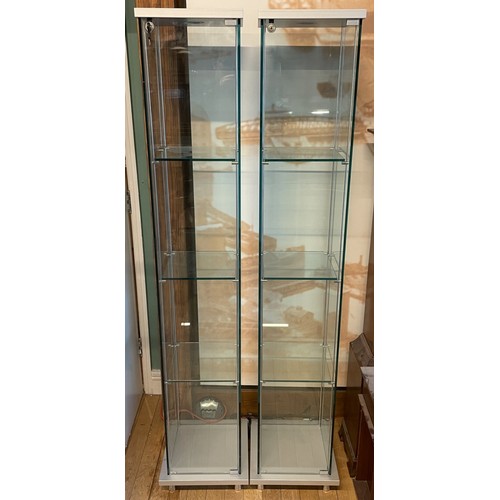 372 - A pair of modern freestanding slimline glazed display cabinets, illuminated with three adjustable gl... 