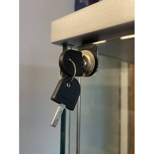 372 - A pair of modern freestanding slimline glazed display cabinets, illuminated with three adjustable gl... 