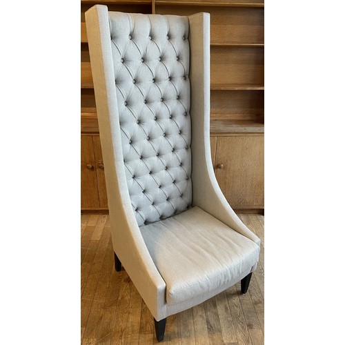 374 - A contemporary Safavieh Mercer style bacall or porters chair,  having high button back with shaped w... 