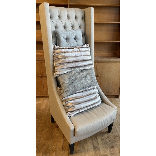 374 - A contemporary Safavieh Mercer style bacall or porters chair,  having high button back with shaped w... 